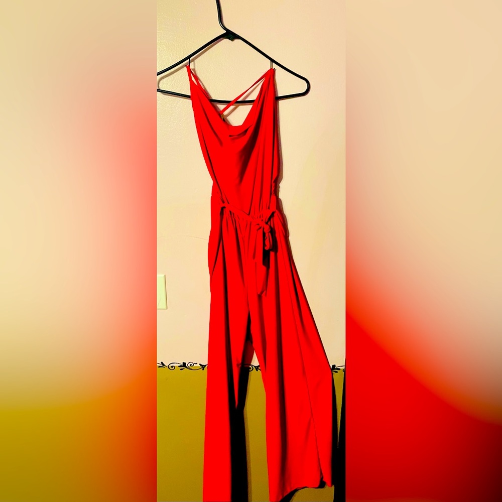 A one piece pants suit. spaghetti straps, bright  pink.women’s size large